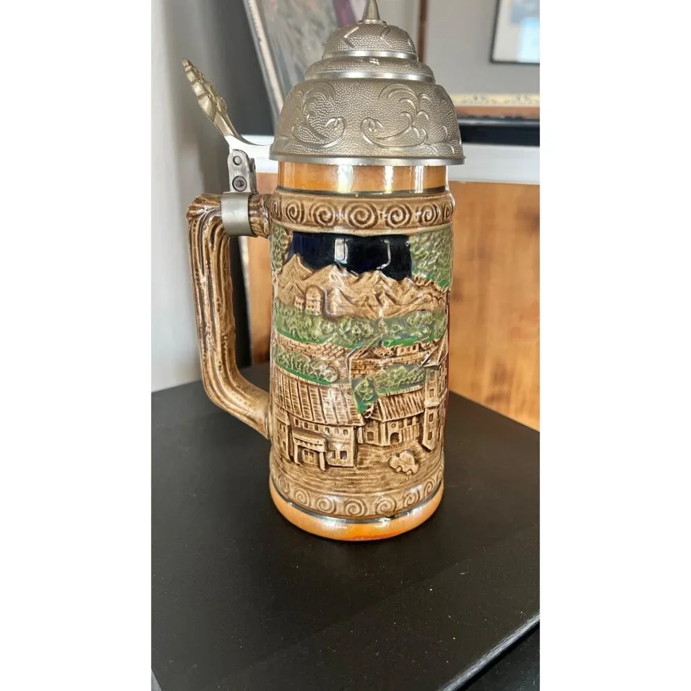Vintage German musical beer stein,  embossed painted scenes, hinged pewter lid